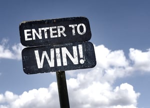 Enter To Win sign with clouds and sky background attract leads to your next manufacturing expo