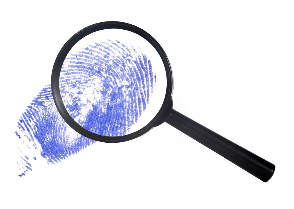 GDPR guide magnifying glass over a blue digital finger print data protection